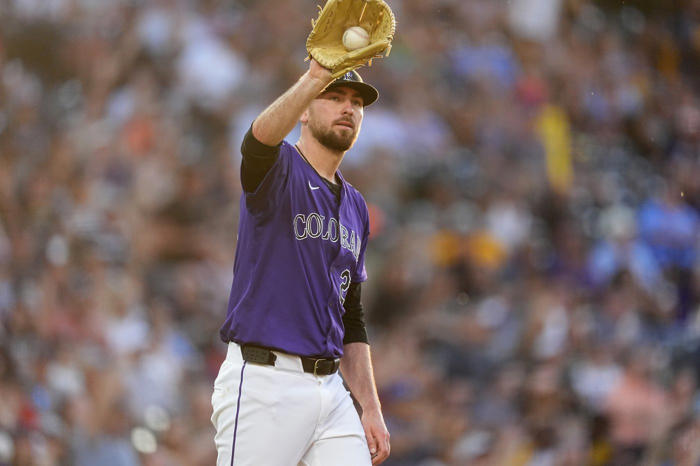 jake cave hits an rbi single in the 10th inning to lift the rockies over the brewers 8-7