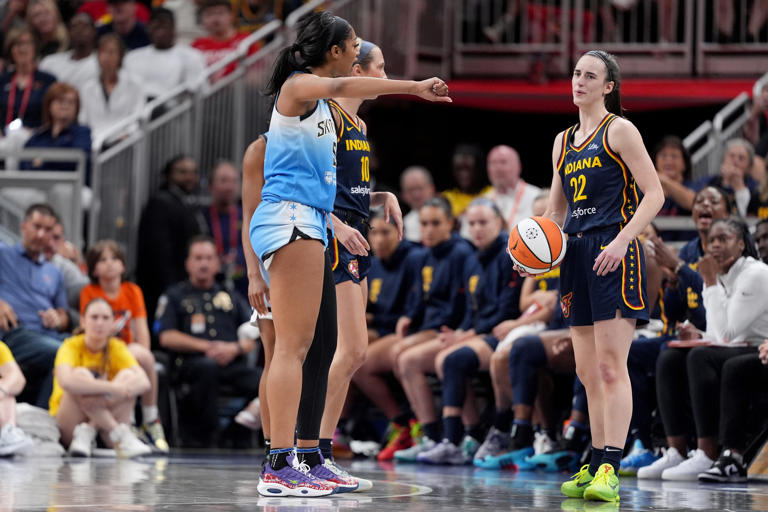 INDIANAPOLIS, INDIANA - JUNE 16: Angel Reese #5 of the Chicago Sky reacts after fouling Caitlin Clark #22 of the Indiana Fever during the second half at Gainbridge Fieldhouse on June 16, 2024 in Indianapolis, Indiana.  Angel Reese could be closing the gap on Rookie of the Year in the WNBA with Caitlin Clark.