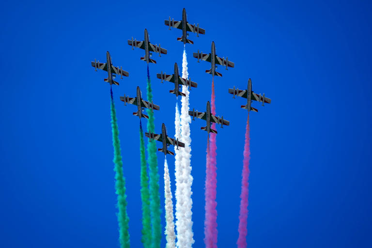 Aircraft of The Frecce Tricolori (Tricolor Arrows) Italian Air Force aerobatic squad fly above the central court of the Foro Italico before a men's tennis semifinal match at the Italian Open tennis tournament, in Rome, Friday, May 17, 2024. (AP Photo/Andrew Medichini)