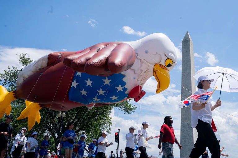 The Washington Monument is seen as participants march during the National Independence Day Parade in Washington, DC, on July 4, 2023. (Photo by Stefani Reynolds / AFP) (Photo by STEFANI REYNOLDS/AFP via Getty Images)