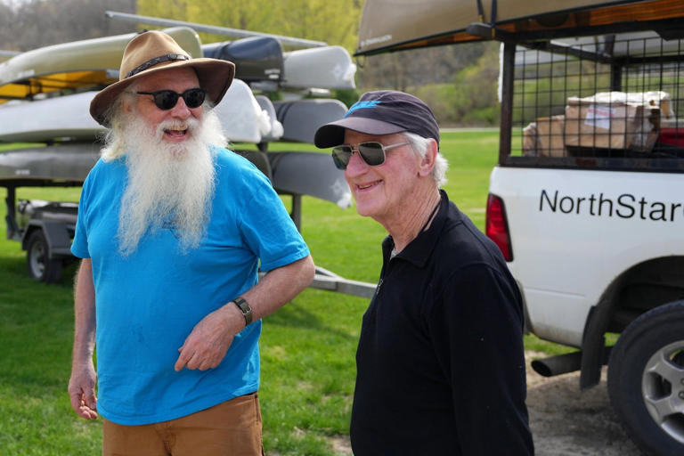 Dan Cooke, left, jokes with canoeing author Cliff Jacobson at an event in Lanesboro in 2023,