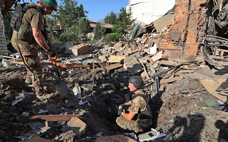 Ukraine’s troops withdraw from district in key hilltop city