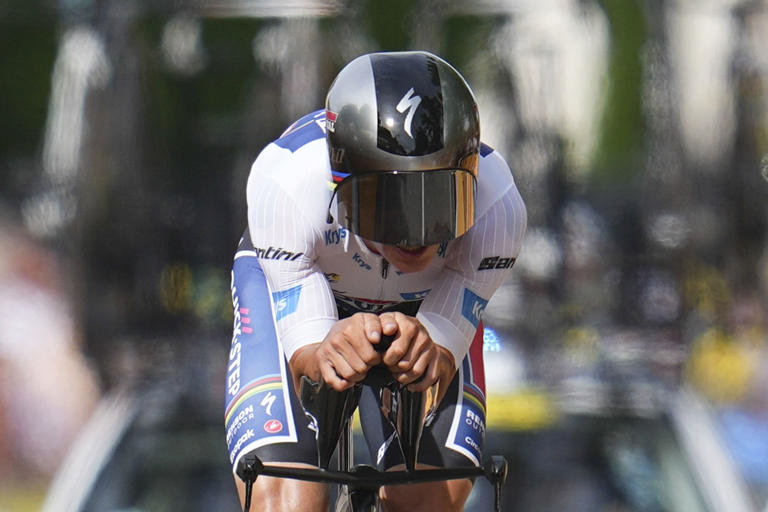 Stage winner Belgium's Remco Evenepoel strains during the seventh stage of the Tour de France cycling race, an individual time-trial over 25.3 kilometers (15.7 miles) with start Nuits-Saint-Georges and finish in Gevrey-Chambertin, France, Friday, July 5, 2024. (AP Photo/Daniel Cole)