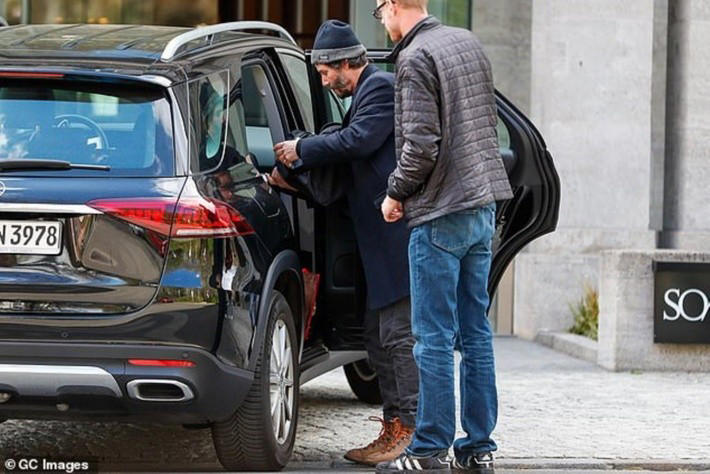 Keanu Reeves alongside his 2019 Mercedes-Benz GLE