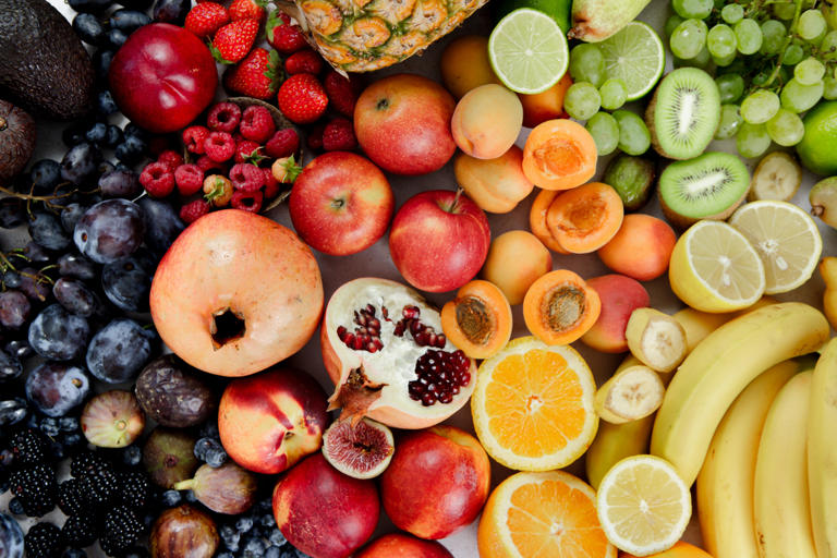 Colorful raw fruits together. Full frame of assortment of healthy and fresh fruits.