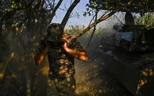 A Ukrainian artilleryman fires a howitzer towards Russian troops near Chasiv Yar, Donetsk, on Sunday - Stringer/Reuters