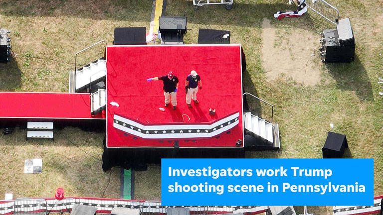 July 15, 2024; Butler, PA, USA; Investigators, including a man on right wearing an FBI shirt, review the stage Monday morning July 15, 2024, where former President Donald Trump was shot Saturday afternoon. He was shot during a rally at The Butler Farm Show Grounds in Butler, Pa, north of Pittsburgh. Mandatory Credit: Doral Chenoweth/Columbus Dispatch