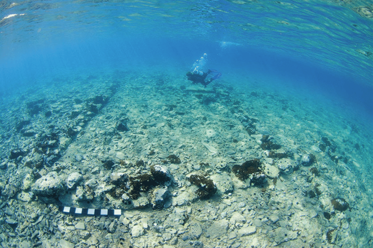 A diver explores Pavlopetri's submerged remains, which include parts of what was once a large rectangular building ((Jon Henderson and the Pavlopetri Project))