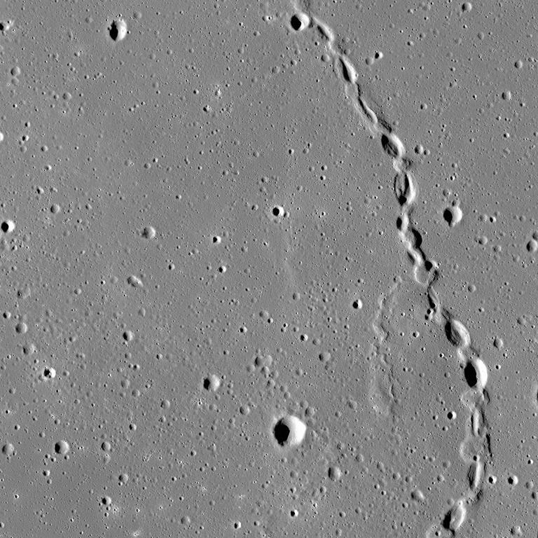 The moon is covered in lava tubes, some of which have collapsed over time dotting the surface with deep pits. You can see here a lava tube on the right with multiple collapsed regions. NASA/GSFC/Arizona State University