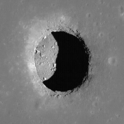 Permanently shadowed regions inside lunar pits like Mare Tranquillitatis, shown here, could be a balmy 63 °F. Lunar Reconnaissance Orbiter Camera