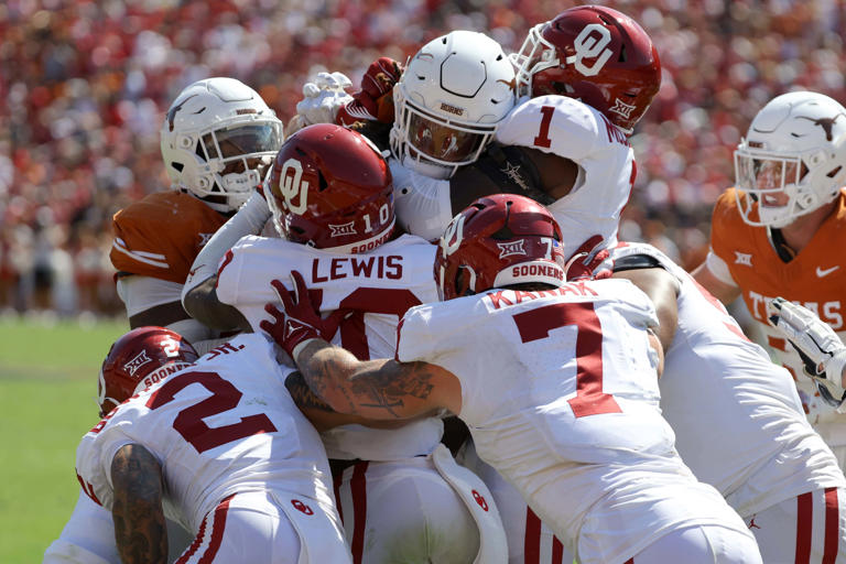 Oklahoma Sooners defensive back Billy Bowman Jr. (2), Oklahoma Sooners linebacker Kip Lewis (10), Oklahoma Sooners linebacker Jaren Kanak (7) and Oklahoma Sooners linebacker Dasan McCullough (1) stop Texas Longhorns running back Jonathon Brooks (24) during the Red River Rivalry college football game between the University of Oklahoma Sooners (OU) and the University of Texas (UT) Longhorns at the Cotton Bowl in Dallas, Saturday, Oct. 7, 2023. Oklahoma won 34-30. BRYAN TERRY/THE OKLAHOMAN / USA TODAY NETWORK