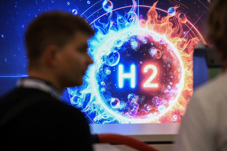 A logo displaying the "H2" hydrogen chemical symbol at the Peter Huber Kaltemaschinenbau SE at the Hannover Messe 2024 trade fair in Hannover, Germany, on Monday, April 22, 2024. German Chancellor Olaf Scholz is optimistic on his country's economic prospects, citing record employment and slowing inflation thanks to falling energy costs.