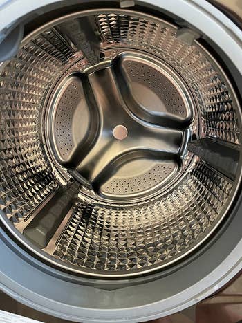 the inside of a reviewer's washing machine looking like new