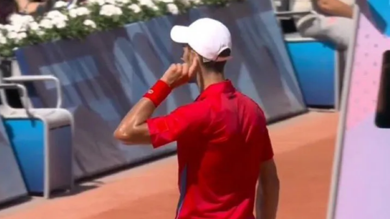 Novak Djokovic pointed to his ear after securing a late break (Picture: @TheTennisLetter)