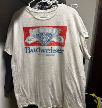 same shirt hanging, less wrinkled after using product