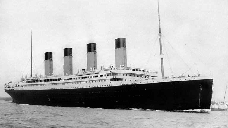 A black and white photograph of the RMS Titanic departing Southampton on April 10, 1912.