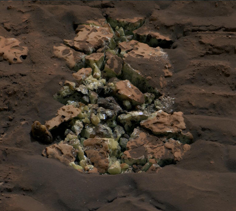 These yellow crystals were revealed after NASA's Curiosity happened to drive over a rock and crack it open on May 30. Using an instrument on the rover's arm, scientists later determined these crystals are elemental sulfur—and it's the first time this kind of sulfur has been found on the Red Planet. Credit: NASA/JPL-Caltech/MSSS