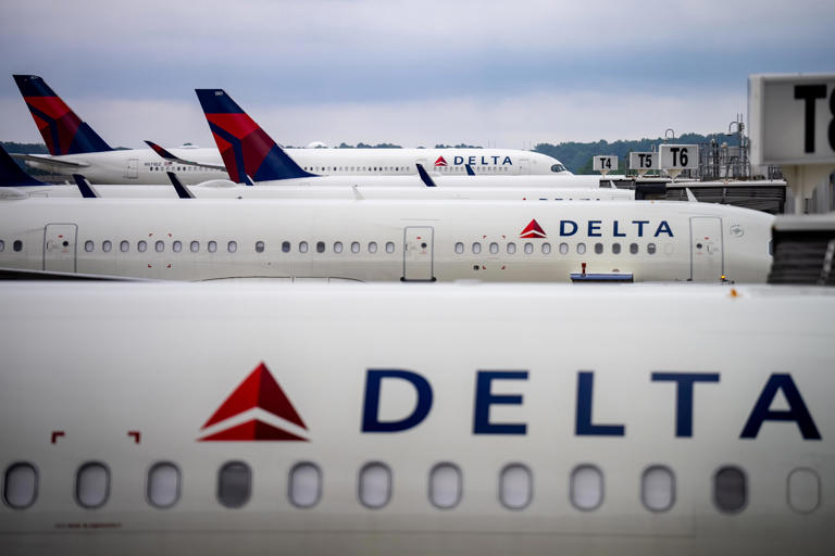 Delta Airlines planes are pictured parked at Hartsfield-Jackson Atlanta International Airport.