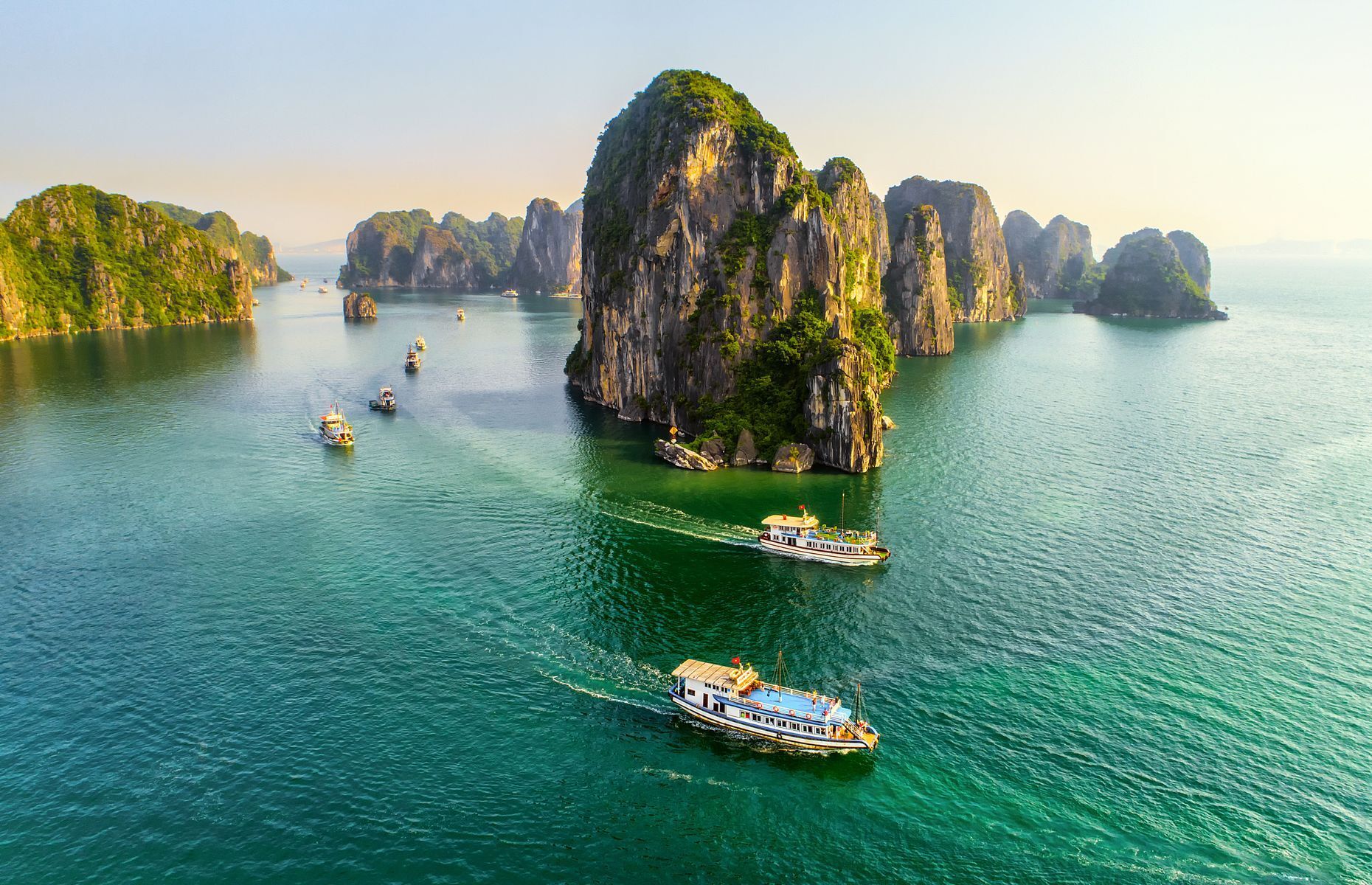 <p>Certainly one of Southeast Asia’s most emblematic locales, <a href="https://www.lonelyplanet.com/vietnam/northeast-vietnam/halong-bay" class="atom_link atom_valid" rel="noreferrer noopener">Ha Long Bay</a> is not only a north Vietnamese natural treasure, but also a <a href="https://whc.unesco.org/en/list/672/" class="atom_link atom_valid" rel="noreferrer noopener">UNESCO</a> World Heritage Site. Thousands of karst islands, covered in lush vegetation, emerge from emerald waters to create a most impressive landscape. Take a trip on a traditional boat to explore its caves and hidden lagoons or opt for kayaking and paddle among its picturesque rock formations. For optimum temperatures outside of the rainy season, schedule your trip between October and April.</p>