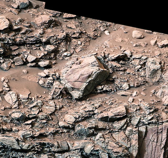 At center, a Martian rock displaying a clear 