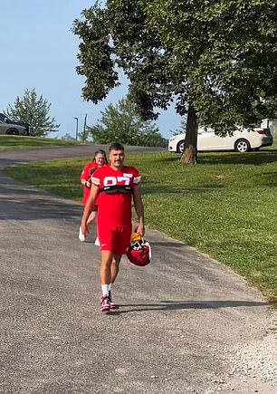 Travis, 34, was seen with his helmet in hand when fans noticed him