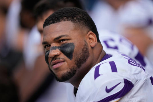 Christian Darrisaw is under contract with the Vikings through 2029. AP