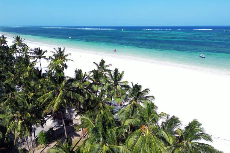 Amazing Diani beach seascape with white sand and turquoise Indian Ocean, Kenya top view,