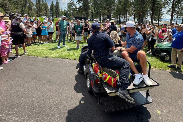 Courtesy Katie Hauss Katie Hauss is wheeled off by paramedics after being hit in the head by Travis Kelce's golf ball