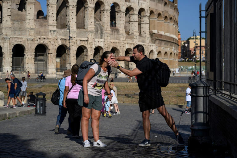People cool off during a heatwave in Rome, Italy (Picture: Getty Images)