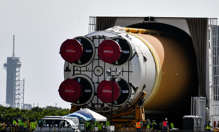 NASA's giant Artemis II moon rocket core rolls out en route to Vehicle ...