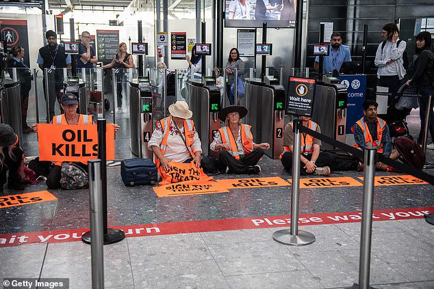 Just Stop Oil eco zealots try to block Heathrow Airport departure gate