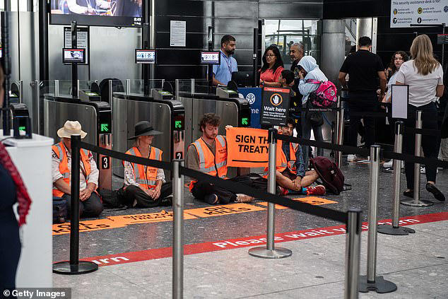 Just Stop Oil eco zealots try to block Heathrow Airport departure gate