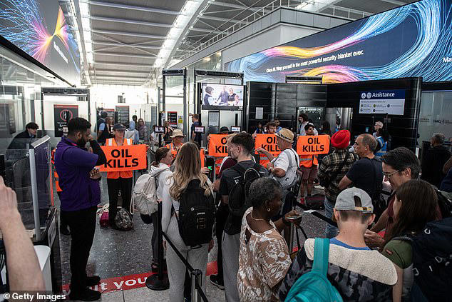 Just Stop Oil eco zealots try to block Heathrow Airport departure gate