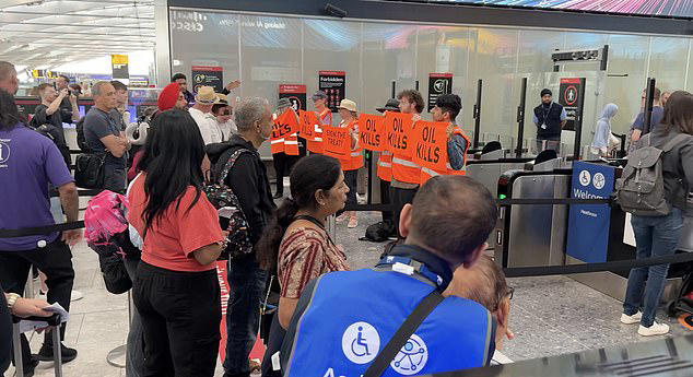 Just Stop Oil eco zealots try to block Heathrow Airport departure gate