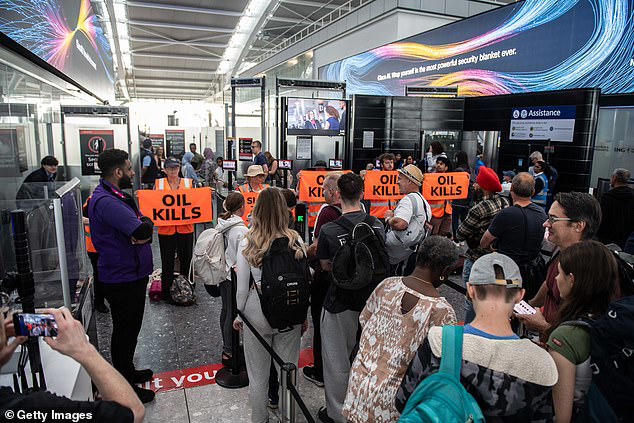 Just Stop Oil eco zealots try to block Heathrow Airport departure gate