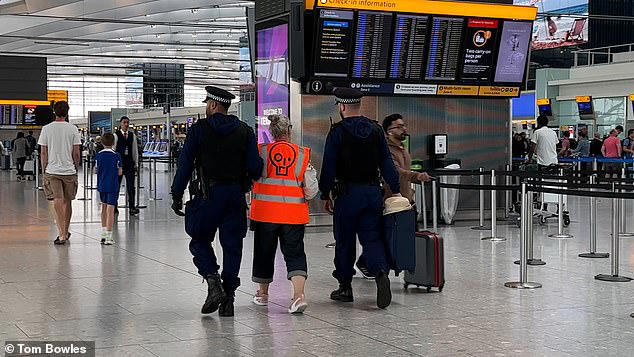 Just Stop Oil eco zealots try to block Heathrow Airport departure gate