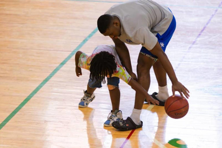 Lamont Butler plays with a camper at S.T. Roach Basketball Camp - Paul Hooper, Lexington Parks & Recreation