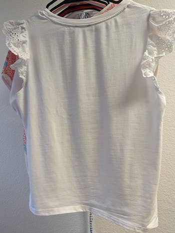 a reviewer photo of the same shirt with visibly less wrinkles
