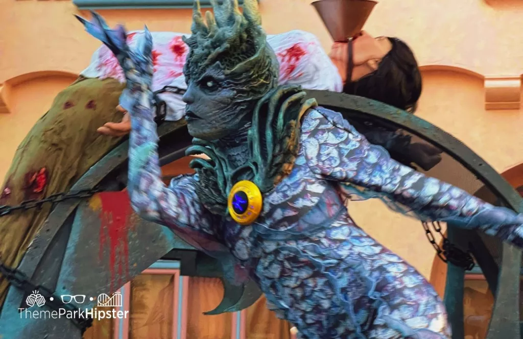 Zodiac Scare Zone and scare actor at 2023 Halloween Horror Nights HHN 32 Universal Studios Orlando. Keep reading to find out more about HHN hotels.