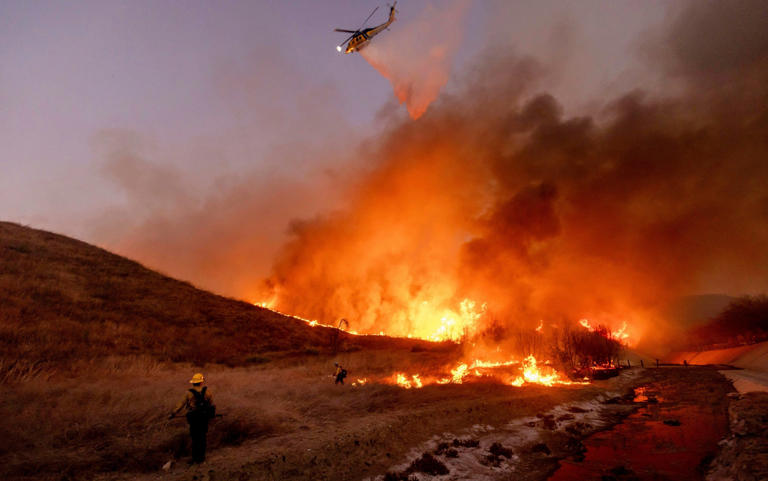 Fire crews battled to extinguish the Kenneth Fire on Thursday - Ethan Swope/AP