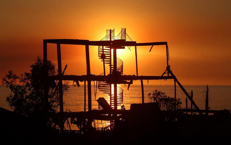 A stairway is all that's left of a house that burned down from the Palisades fire on PCH in Malibu. ((Wally Skalij/Los Angeles Times))