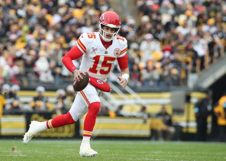 Dec 25, 2024; Pittsburgh, Pennsylvania, USA; Kansas City Chiefs quarterback Patrick Mahomes (15) runs with the ball against the Pittsburgh Steelers during the first quarter at Acrisure Stadium. Mandatory Credit: Charles LeClaire-Imagn Images