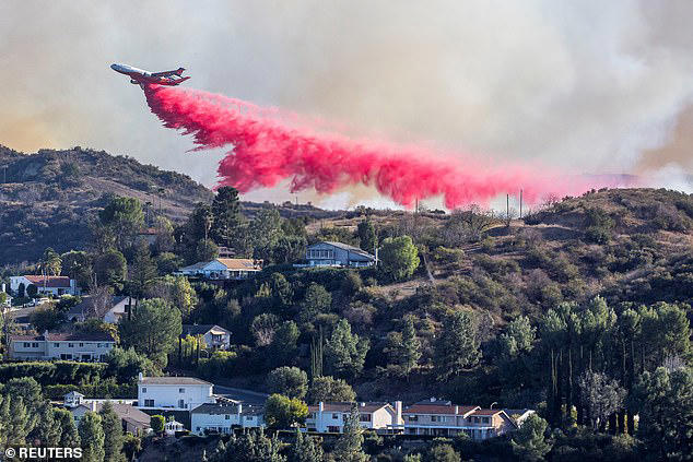 The spray, known as Phos-Chek, has been dropped from nine large planes and 20 water-dropping helicopters across Los Angeles to fight the fires that have been burning since Tuesday