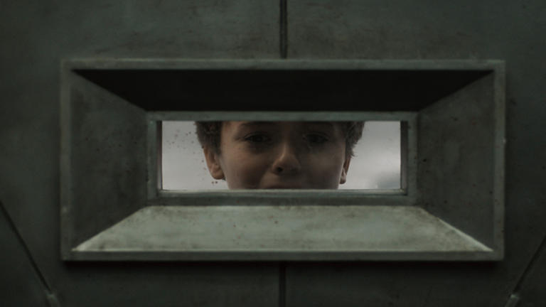 A 12-year-old Solo watches his father killed from Silo 17's vault (Image credit: Apple TV+)