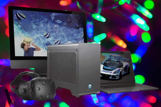 Akitio Node Titan eGPU next to devices including a VR headset, laptop, and monitor