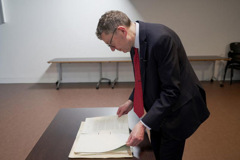 Historian and "MI5: Official Secrets" exhibition curator Mark Dunton reviews MI5 documents, at the National Archives in London, Britain, January 13, 2025. REUTERS/Marissa Davison