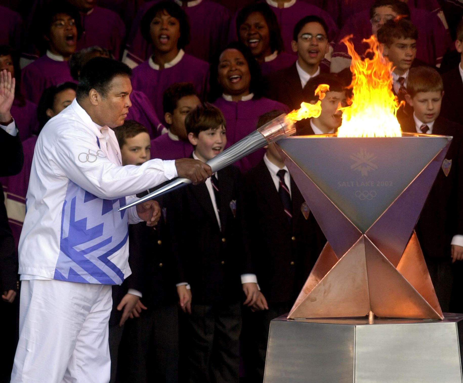 Ali lights the first Olympic torch for the Salt Lake 2002 Olympic Winter Games at Centennial Olympic Park in Atlanta in 2001.
