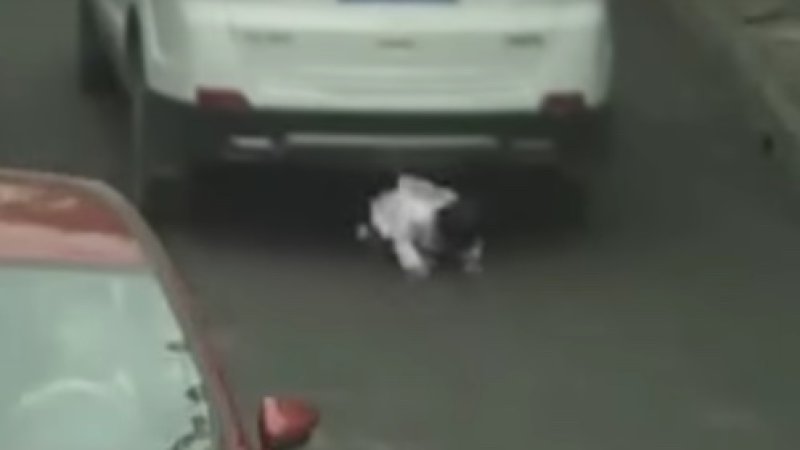Watch double miracle as toddler survives being run over by two SUVs