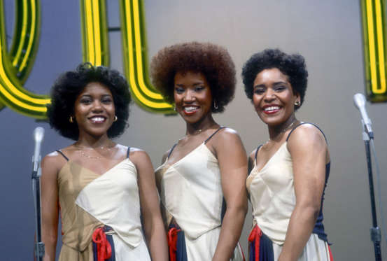 Slide 3 of 40: LOS ANGELES - AUGUST 1977:  R and B group The Emotions (L-R Pamela Hutchinson, Wanda Hutchinson and Sheila Hutchinson) pose for a portrait on the set of the TV show 'Soul Train' in August 1977  in Los Angeles, California. (Photo by Michael Ochs Archives/