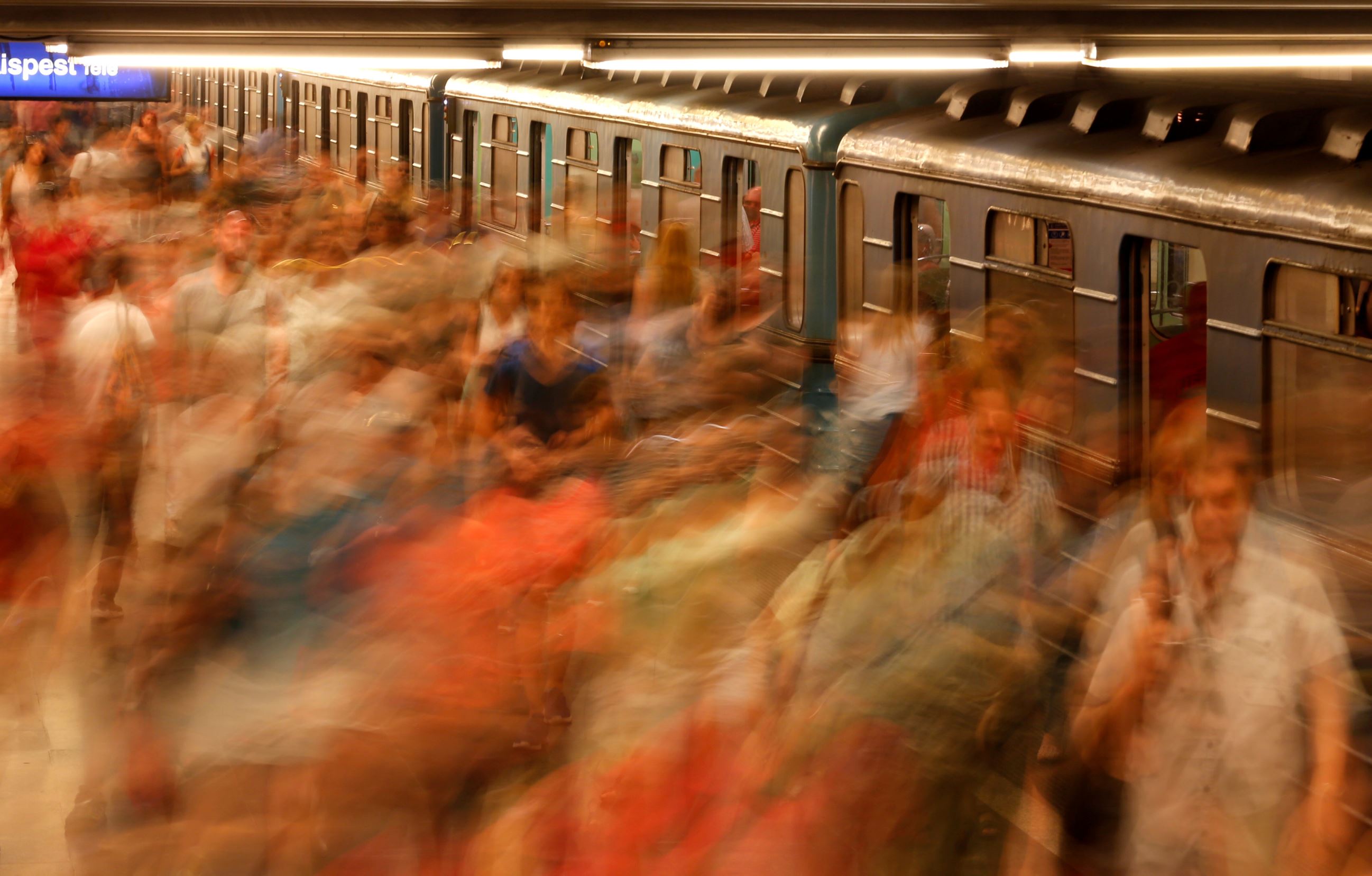 Slide 17 of 33: Commuters walk during the evening rush after arriving at a subway station in Budapest, Hungary, June 13, 2017. REUTERS/Laszlo Balogh TPX IMAGES OF THE